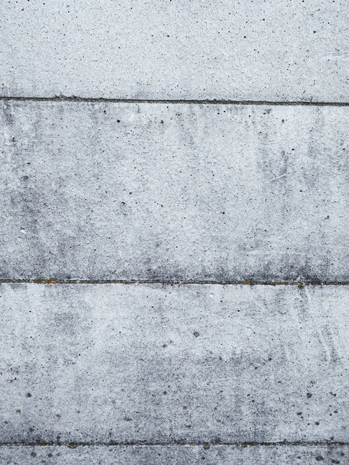 汚れや劣化が見られるコンクリートの壁のテクスチャー