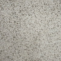 細かい粒を固めたグレーの壁テクスチャーの写真