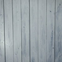 白くペイントされた木目が見える板のテクスチャーの写真