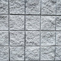 表面に凹凸のある正方形のグレータイル（テクスチャー）の写真