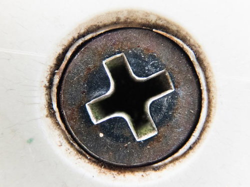 Close-up of Rusted Phillips Screw Hole