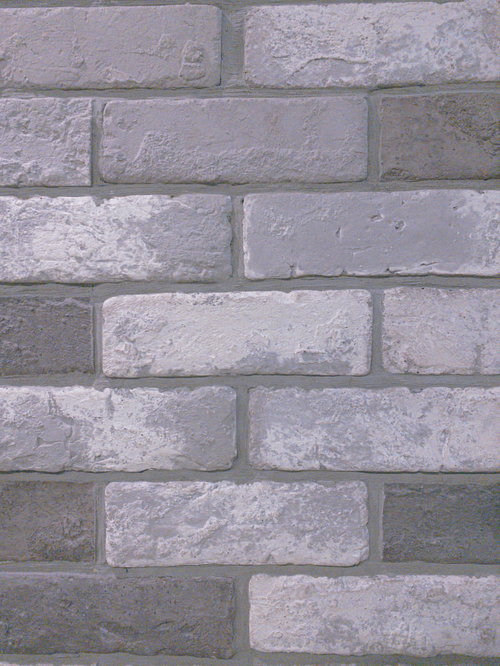 グレーの煉瓦を重ねた外壁のテクスチャ