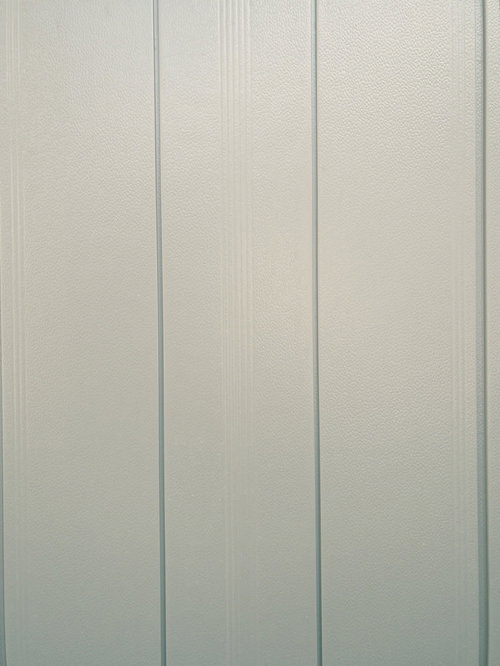 薄く縦線模様のある壁のテクスチャー写真