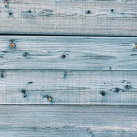節に色が乗らない薄いブルーグレーの板壁テクスチャーの写真