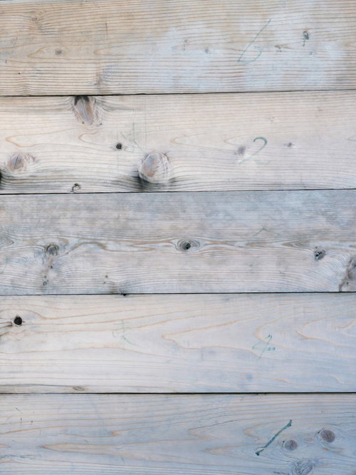 数字が書かれた白い板壁の節のあるテクスチャ