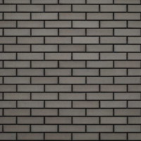 薄汚れたグレータイル壁のテクスチャーの写真