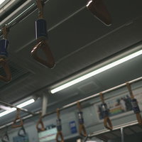 電車の車内に吊り下がるつり革の写真