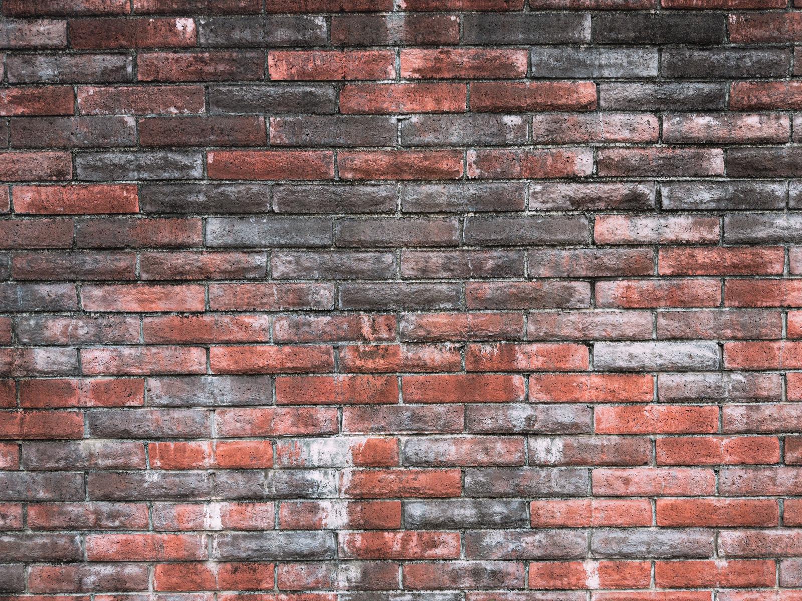 色褪せた赤レンガの壁面テクスチャー