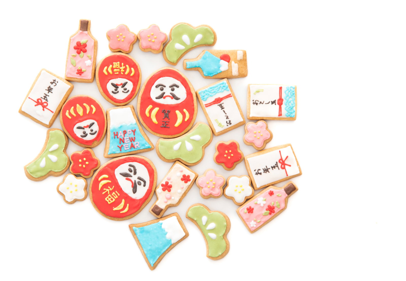 お正月をテーマにしただるまや羽子板などが描かれたアイシングクッキー