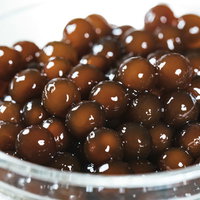 茹であがったタピオカの粒 - デンプン製の透明感のある食材の写真
