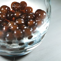 つぶつぶ注意、グラスの底に沈殿したブラックタピオカの写真