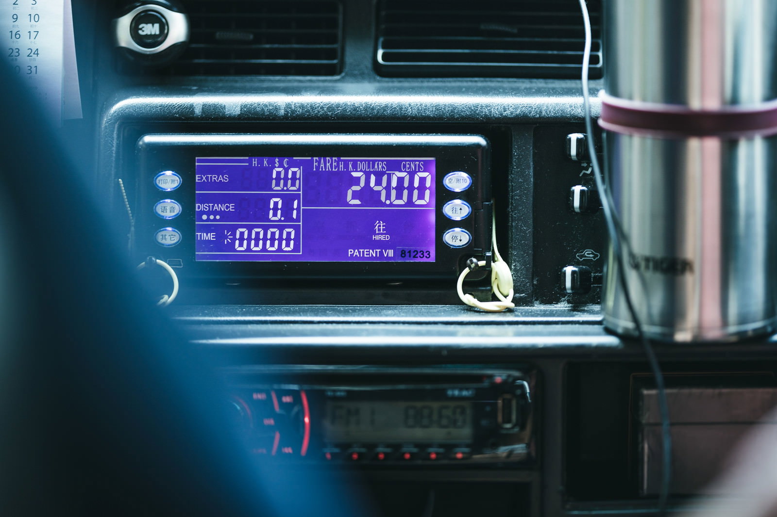 Digital taxi meter display inside a Hong Kong taxi