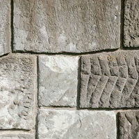 様々な模様を残したセメントタイルの壁面のテクスチャーの写真