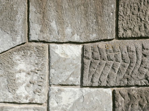 様々な模様を残したセメントタイルの壁面のテクスチャー