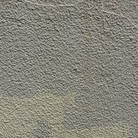 下地と違う色で塗られた壁のテクスチャーと汚れの写真