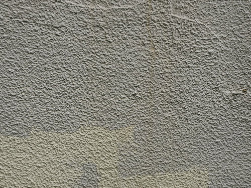 下地と違う色で塗られた壁のテクスチャーと汚れ