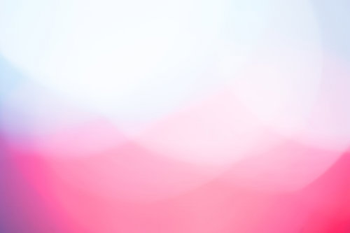 寒色と暖色が混ざり合う光のボケ背景