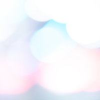 淡くボケる光の中のカラフルなフレアの写真