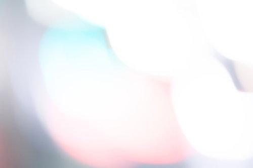 パステルカラーの閃光とボケ味 やわらかい光の背景