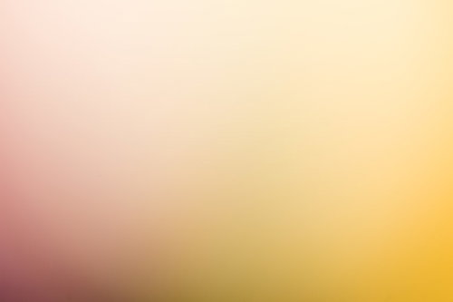 薄暗い黄色からオレンジへのグラデーション背景