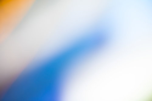 青いボケた光のグラデーション背景