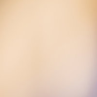 色あせた暖色系の光のボケ背景の写真
