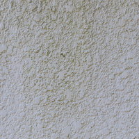 古いマンションの壁のテクスチャー 風雨による劣化と汚れの写真