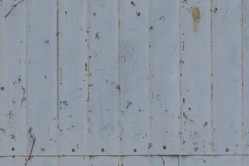 錆びたトタン壁面のテクスチャー写真