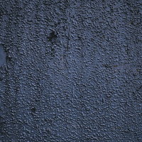 表面に細かいブツブツの残る灰色コンクリート壁のテクスチャの写真