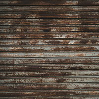 劣化して錆が付くシャッターのテクスチャの写真