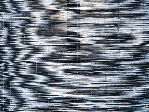 日に焼けた簾のテクスチャー。竹製の伝統的な日除け