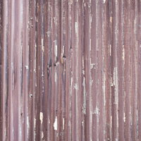 表面の塗装が剥がれ落ちた波板のテクスチャーの写真