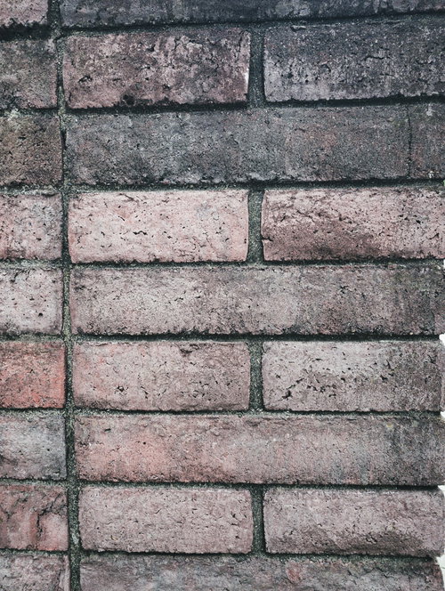 色褪せたレンガ壁のテクスチャ