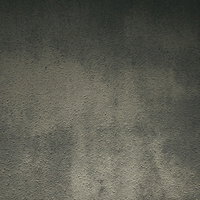 明暗の付いたコンクリート外壁のテクスチャの写真