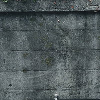 斑点のようなシミのある擁壁のコンクリートテクスチャの写真