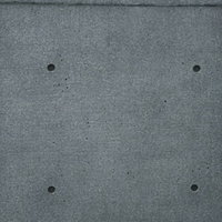 埋めたセパ穴とコンクリート打ちっぱなし壁の写真