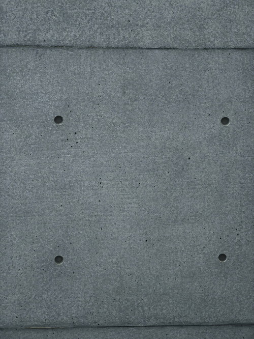 埋めたセパ穴とコンクリート打ちっぱなし壁