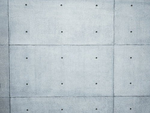 塞いだピーコン穴とコンクリート打ちっぱなしの壁面テクスチャ