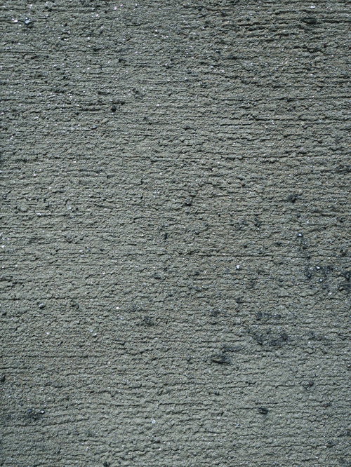 ざらざらした質感のコンクリート壁の無機質なテクスチャー