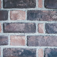 目地が際立つレンガ造りの壁テクスチャーの写真