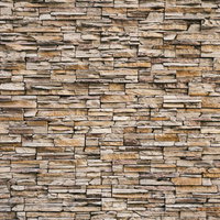 茶色の石材タイルを積み上げた壁のテクスチャの写真