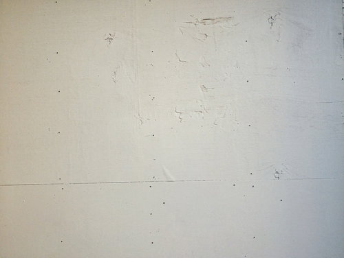 白く塗られたベニヤ板の壁面テクスチャ