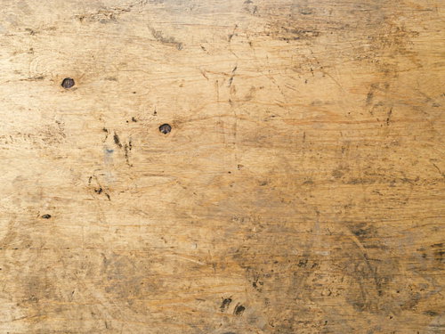 うっすらと足跡の付いたベニヤ板のテクスチャー