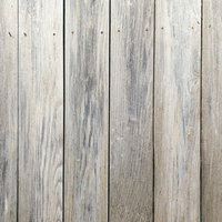 ビスが抜けかけた板壁のテクスチャーの写真