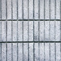 溝が規則正しく刻まれたブロック塀のテクスチャの写真