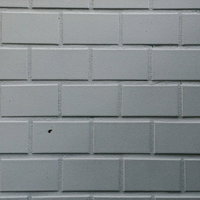 白いレンガタイルの外壁テクスチャ 目地部分のクローズアップの写真