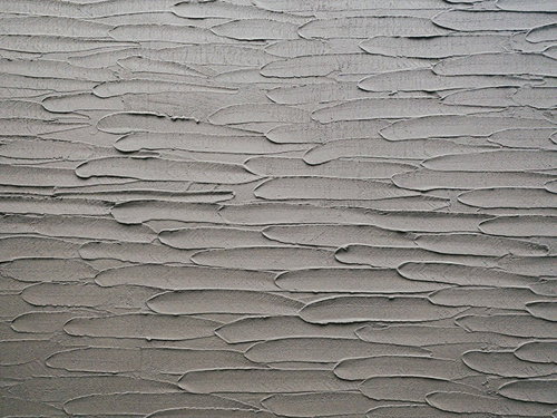 コテ塁りの外壁テクスチャ、引きずり仕上げの波模様