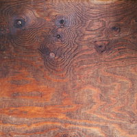フシが散らばるナチュラルな一枚板の天板テクスチャの写真