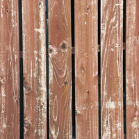 塗装の剥げた板壁のテクスチャーの写真