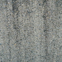 砂利が混ざったセメント壁のざらざらしたテクスチャの写真